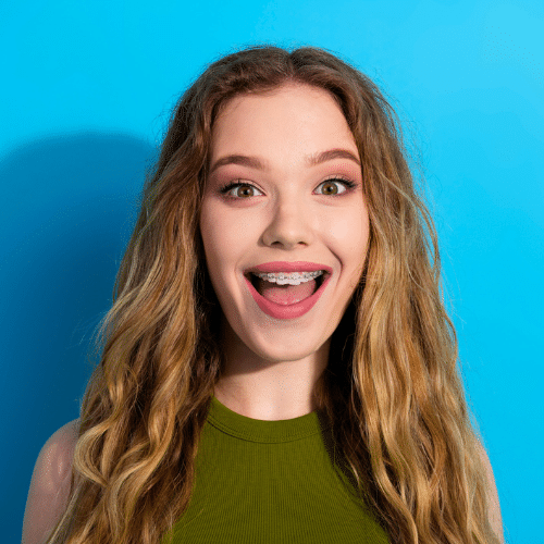 Smiling woman with curly hair open mouthed | Bright Orthodontics in Oshkosh, WI
