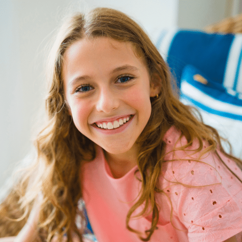 Smiling young woman with braces outdoors | Bright Orthodontics in Oshkosh, WI