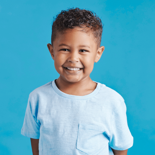 Smiling young boy with blue eyes outdoors | Bright Orthodontics in Oshkosh, WI