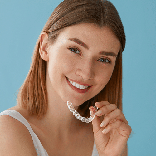 Smiling young woman with brown hair outdoors | Bright Orthodontics in Oshkosh, WI